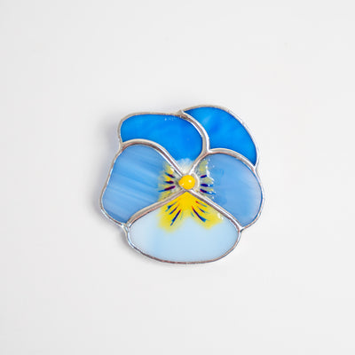 Stained glass different shades of blue with yellow inside pansy flower brooch