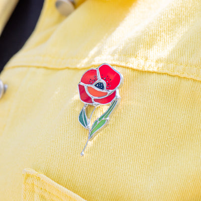 Stained glass poppy flower brooch in yellow shirt
