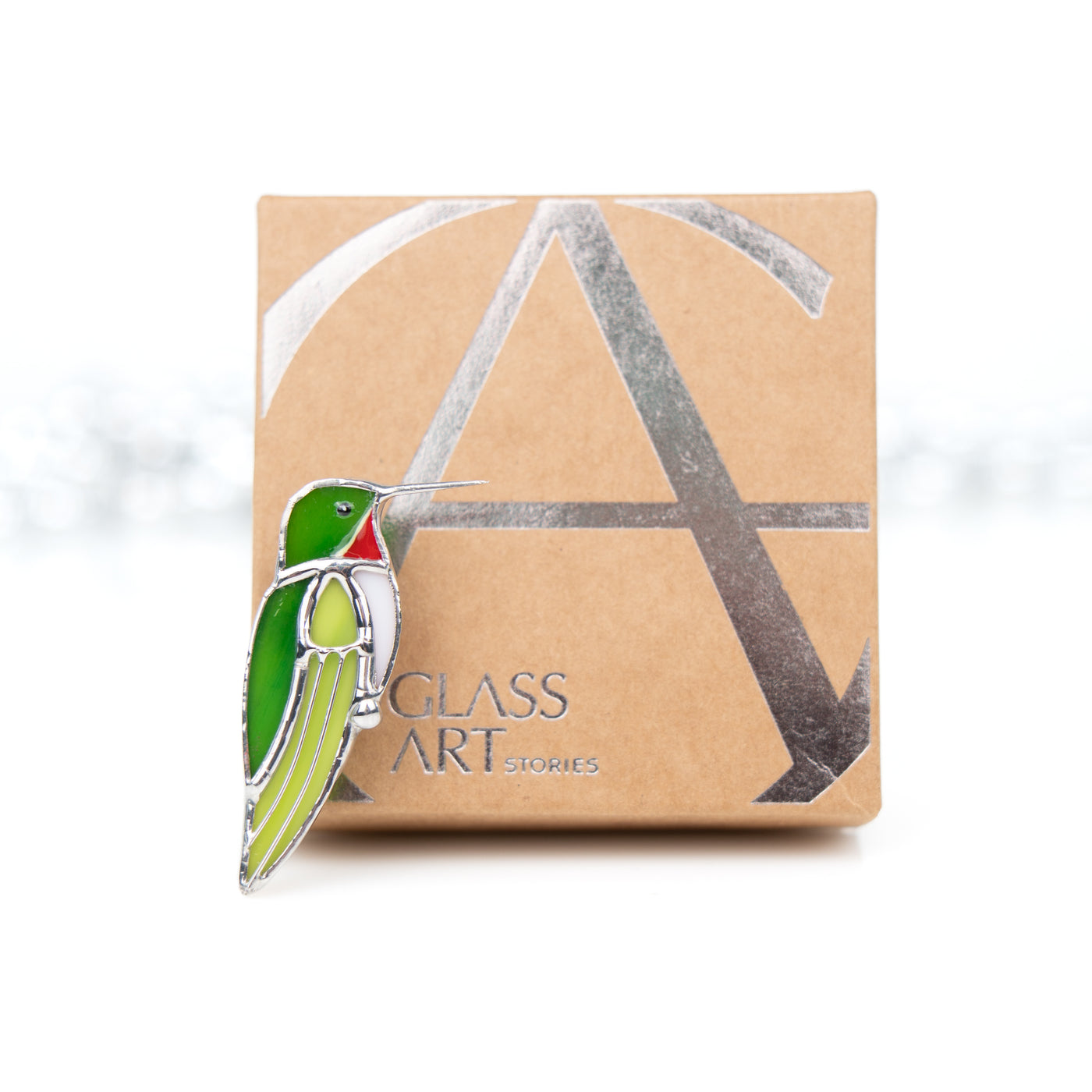 Stained glass hummingbird pin and a brand box