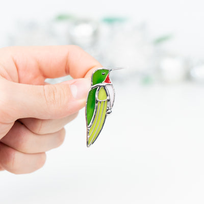 Zoomed stained glass green hummingbird pin