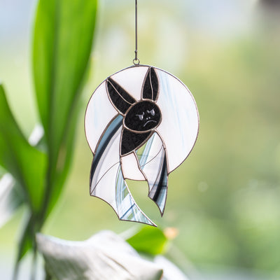 Stained glass Halloween bat with grey wings on the white moon suncatcher