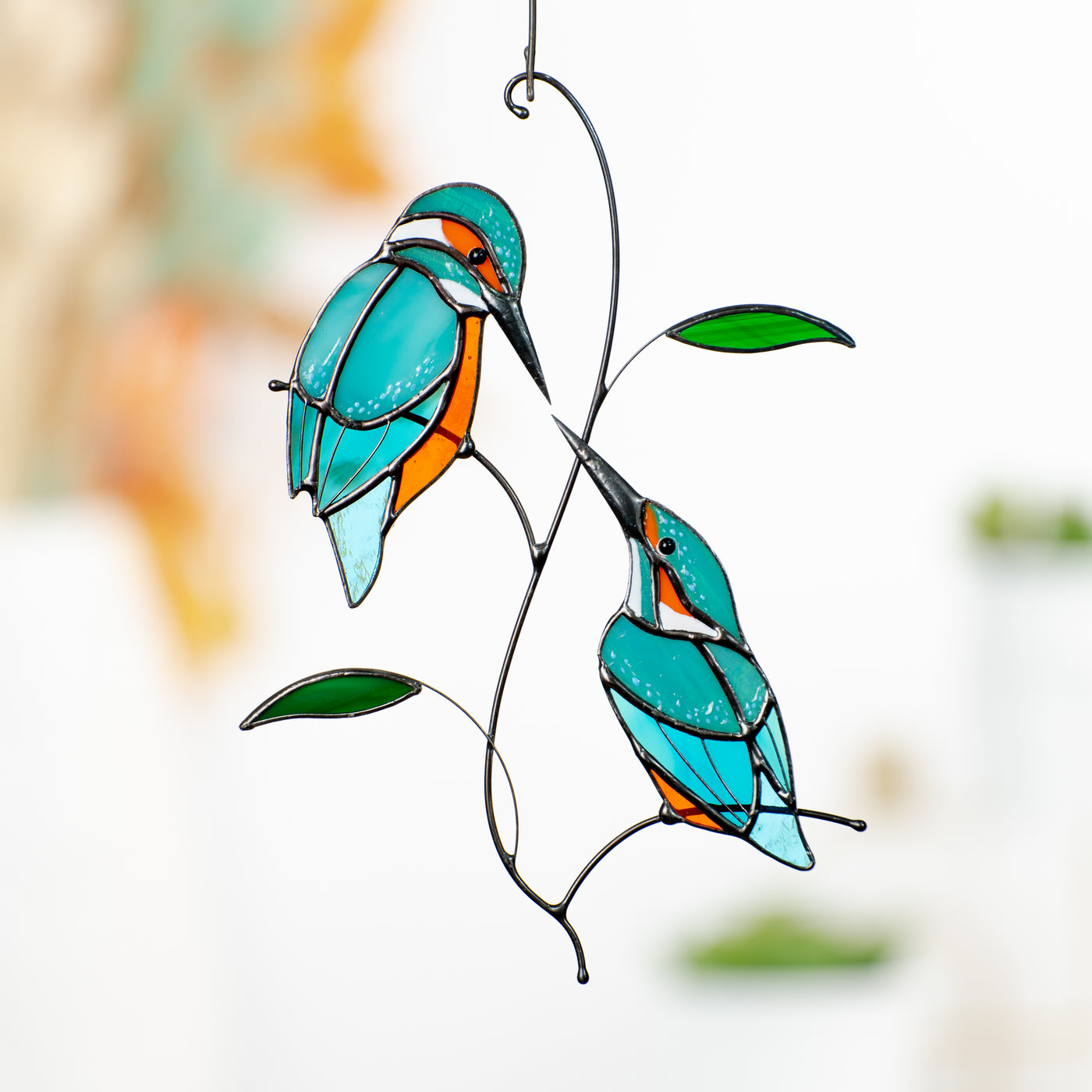 Two kingfishers on the branch looking at each other window hanging of stained glass 