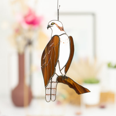 Stained glass osprey sitting on the branch looking left suncatcher