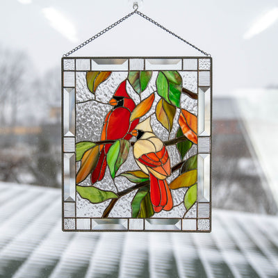 Stained glass window hanging of a couple of cardinals