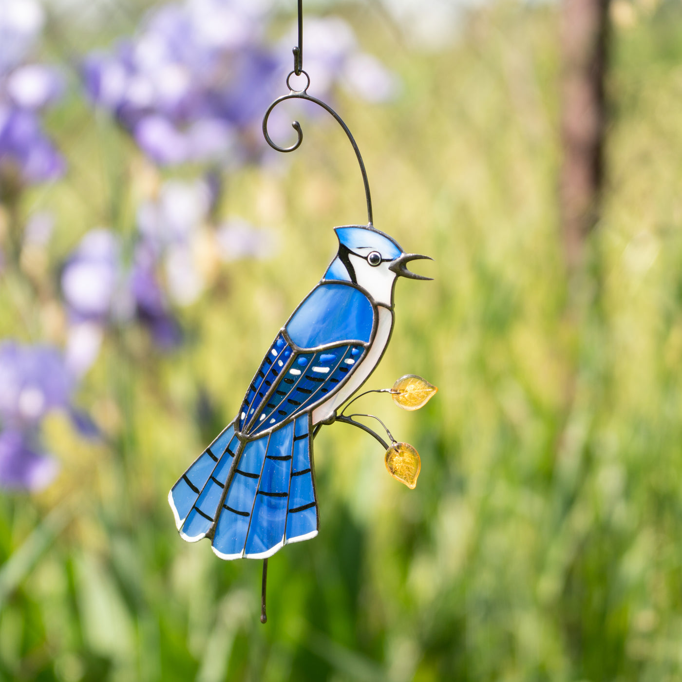Blue jay with feathery bird suncatcher of stained glass