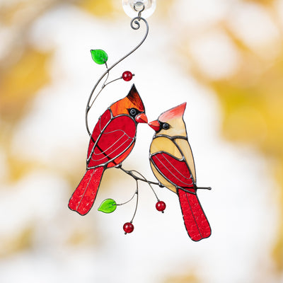 Stained glass suncatcher of a kissing cardinals on the branch 