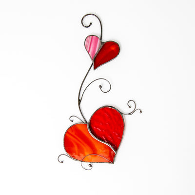 Red stained glass hearts with the oink part window hanging 