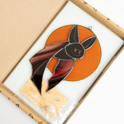 Stained glass bat on orange moon suncatcher in a brand box