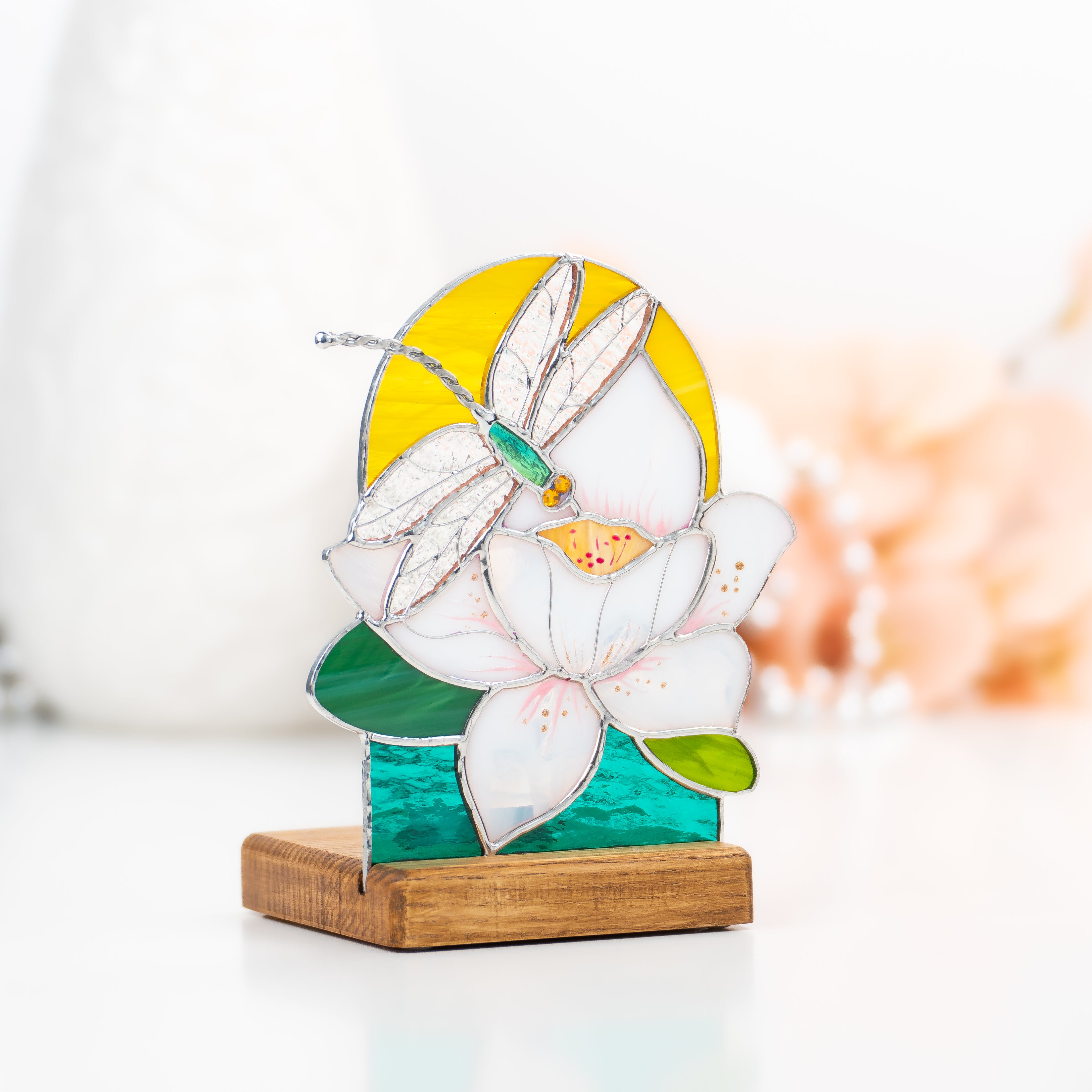 Side-view of the stained glass candle-lit dragonfly panel