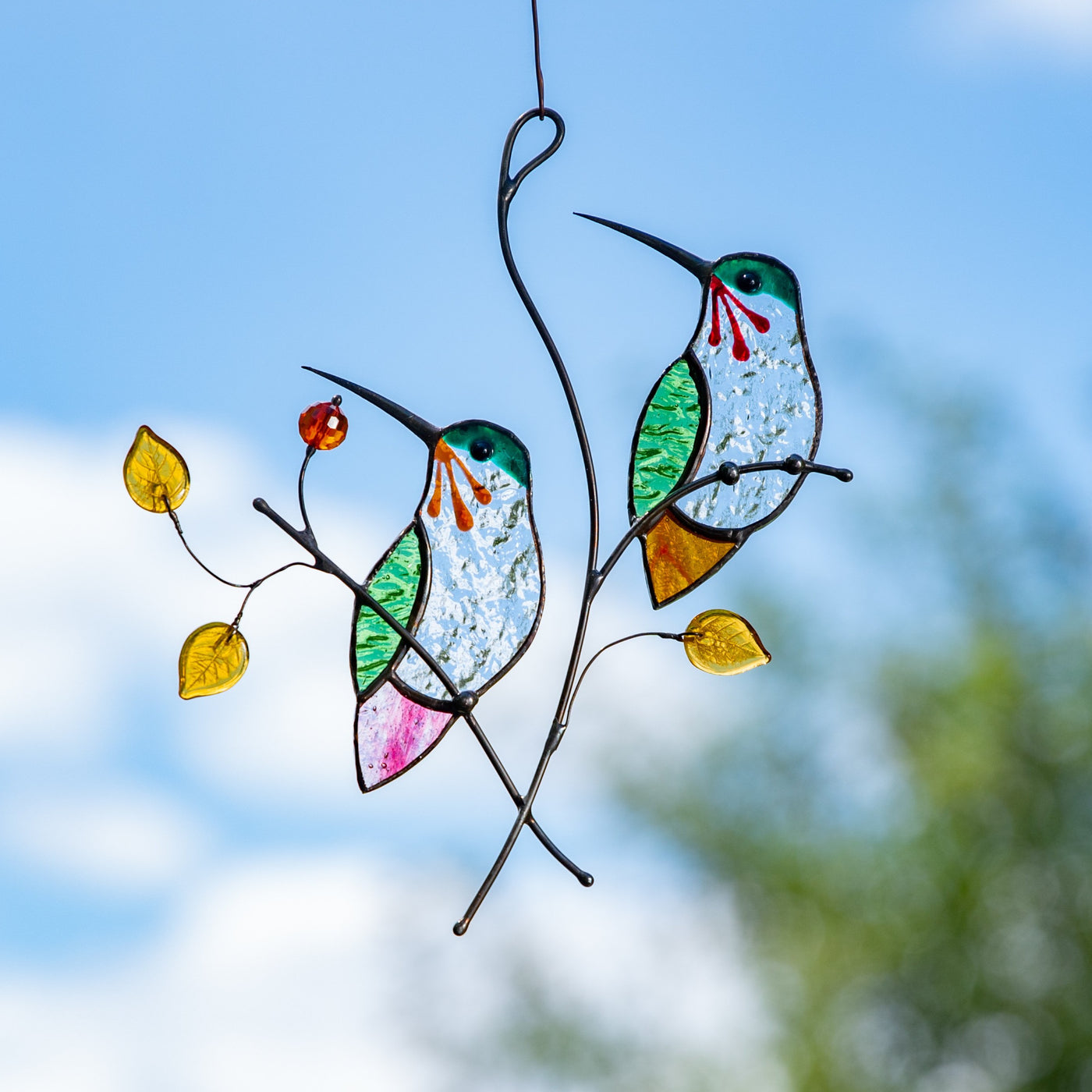 Stained glass hummingbirds sitting on the branch with leaves and berries window hanging for home decor