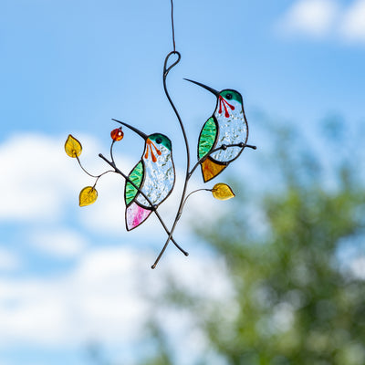 Pair of stained glass hummingbirds on the branch with leaves and berries window hanging