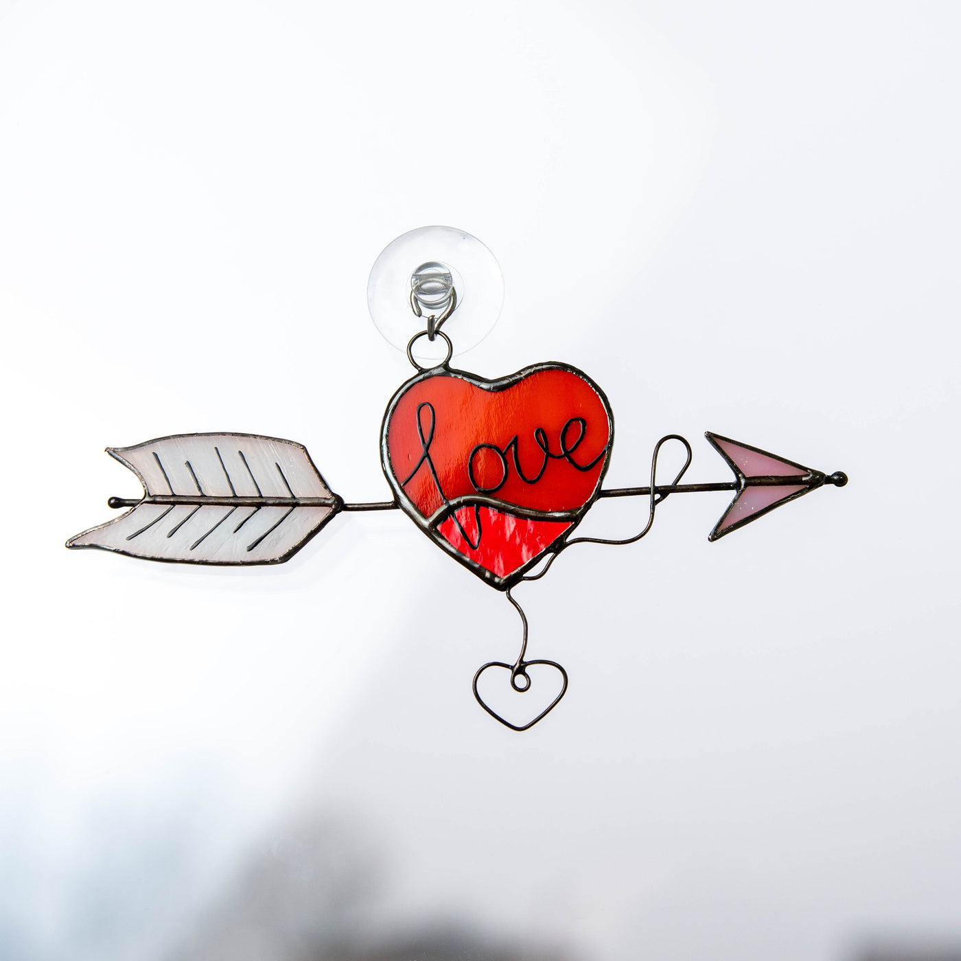 Stained glass heart with arrow window hanging 