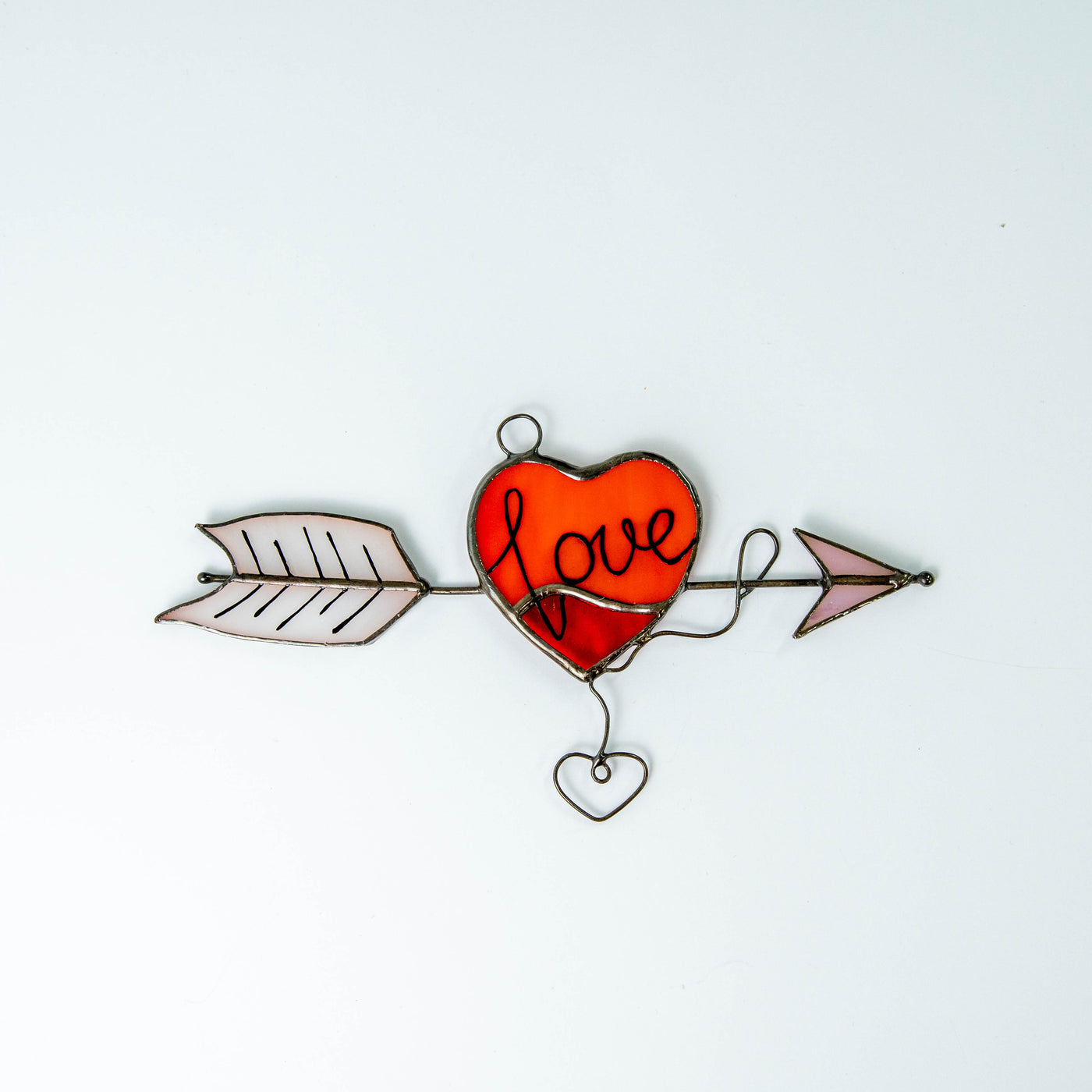 Red heart with an arrow suncatcher made of stained glass