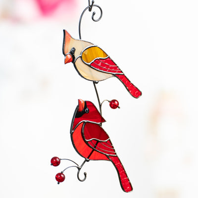 Stained glass male and female cardinals looking at each other window hanging 