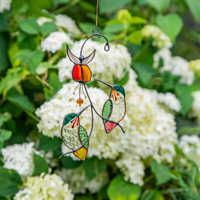Two hummingbirds with flower window hanging of stained glass