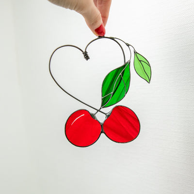 Two cherries with the leaves suncatcher of stained glass