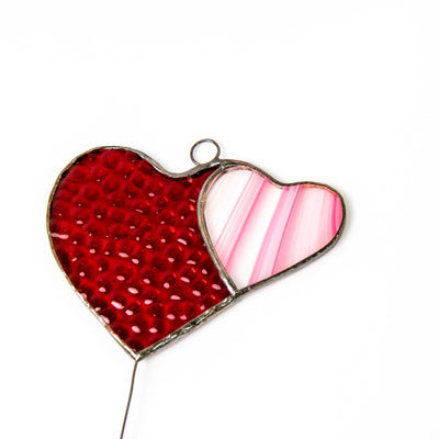 Zoomed stained glass red heart with the pink heart