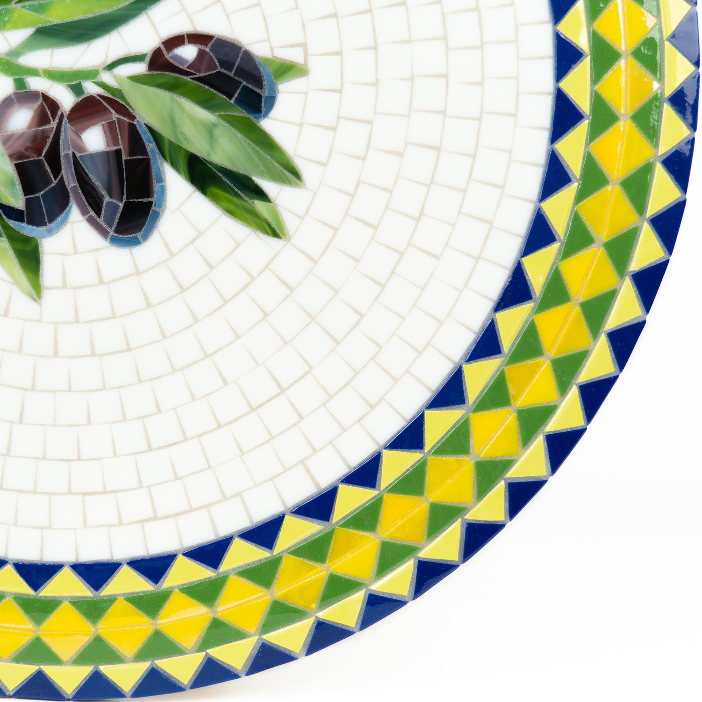Zoomed stained glass mosaic table depicting olives