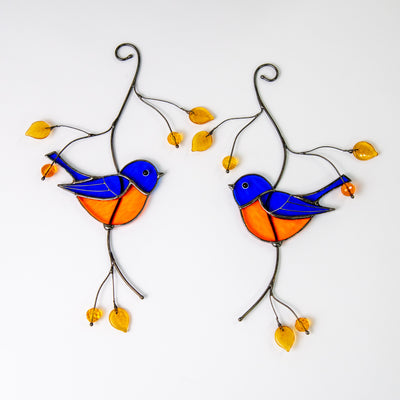 Pair of bluebirds sitting on the branch with leaves and berries stained glass suncatcher