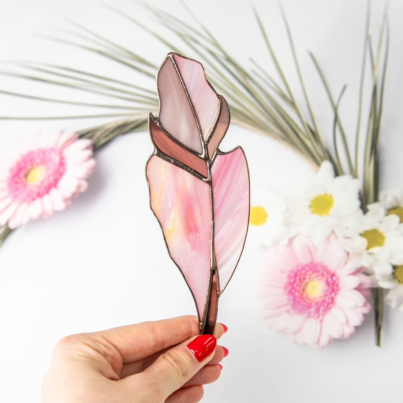 Stained glass pink with its darker shades feather suncatcher