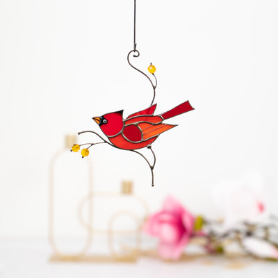 Male winter redbird window hanging made of stained glass 