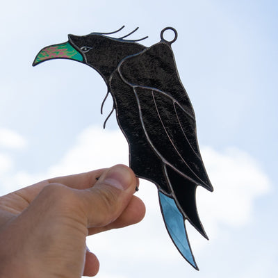 Window hanging of a stained glass raven 
