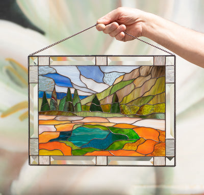 Stained glass window panel depicting Yellowstone national park