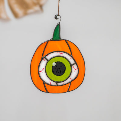 Stained glass Halloween pumpkin with the green eye suncatcher