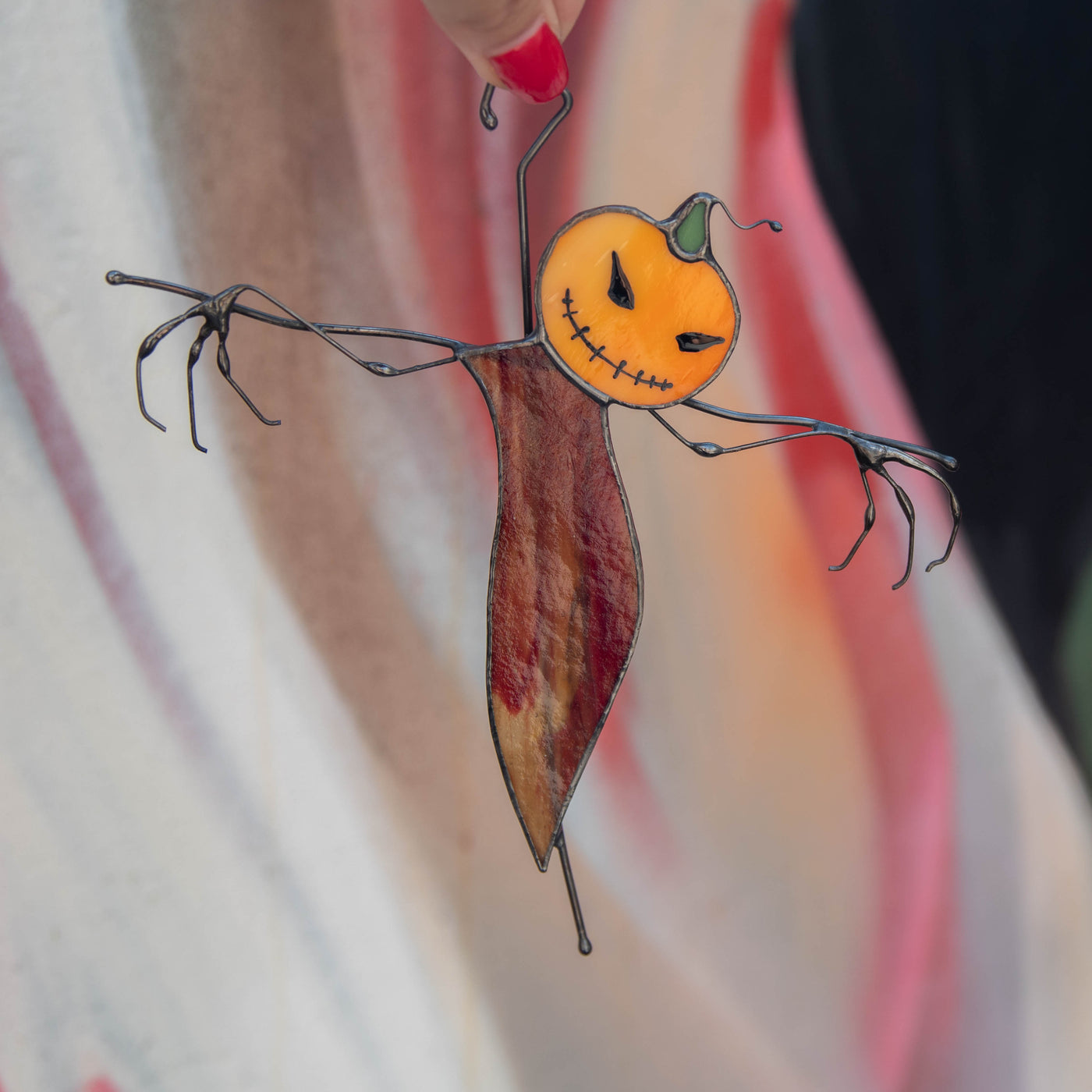 Stained glass pumpkin scarecrow with reddish orange body window hanging