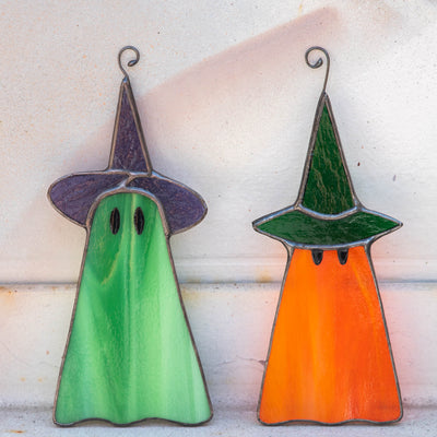 Two stained glass ghosts window hangings