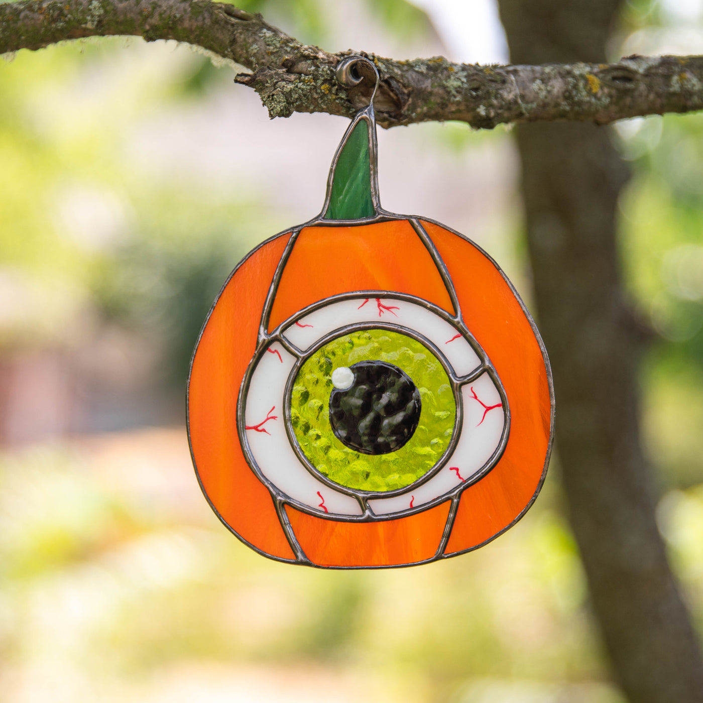 Stained glass pumpkin with the green eye suncatcher 