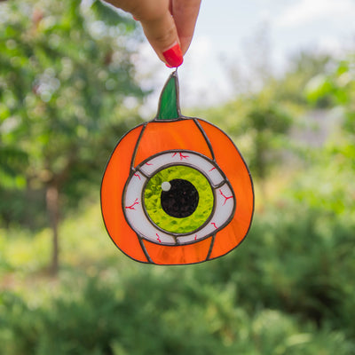 Pumpkin with the green eye suncatcher of stained glass