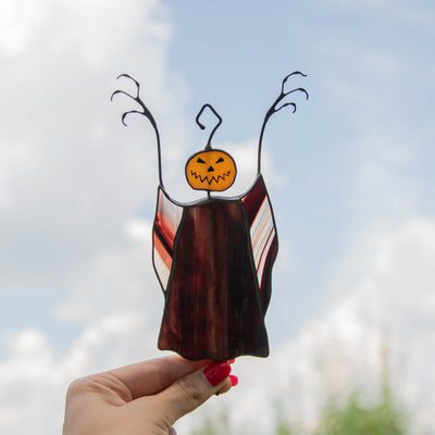 Pumpkin-headed stained glass scarecrow window hanging for Halloween party