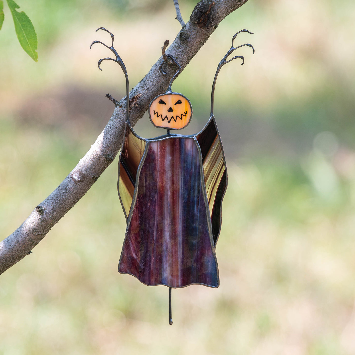 Stained glass pumpkin headed scarecrow window hanging