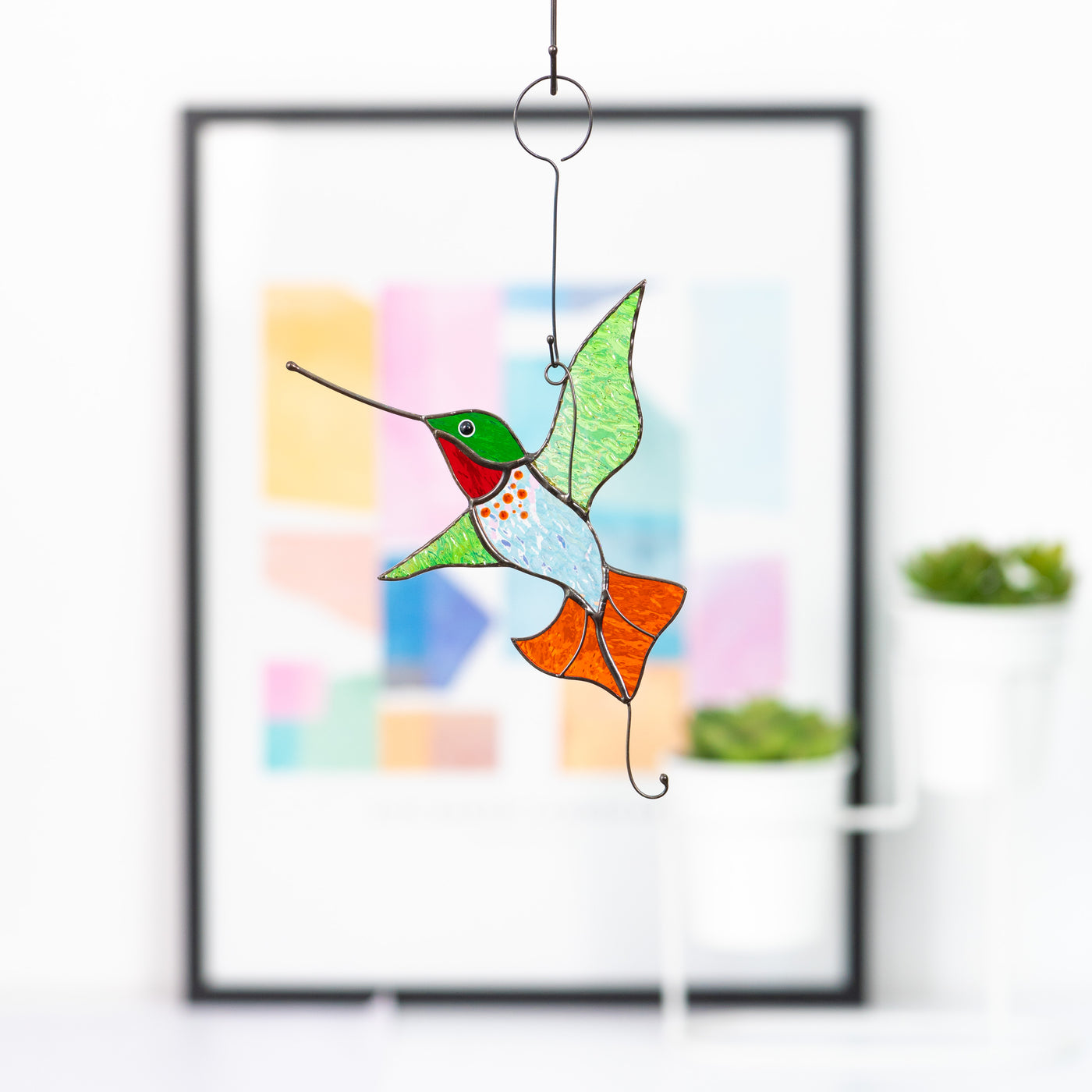 Handcrafted stained glass shining hummingbird suncatcher