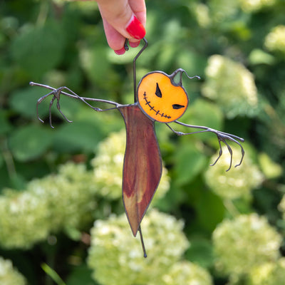 Pumpkin-head stained glass scarecrow suncatcher