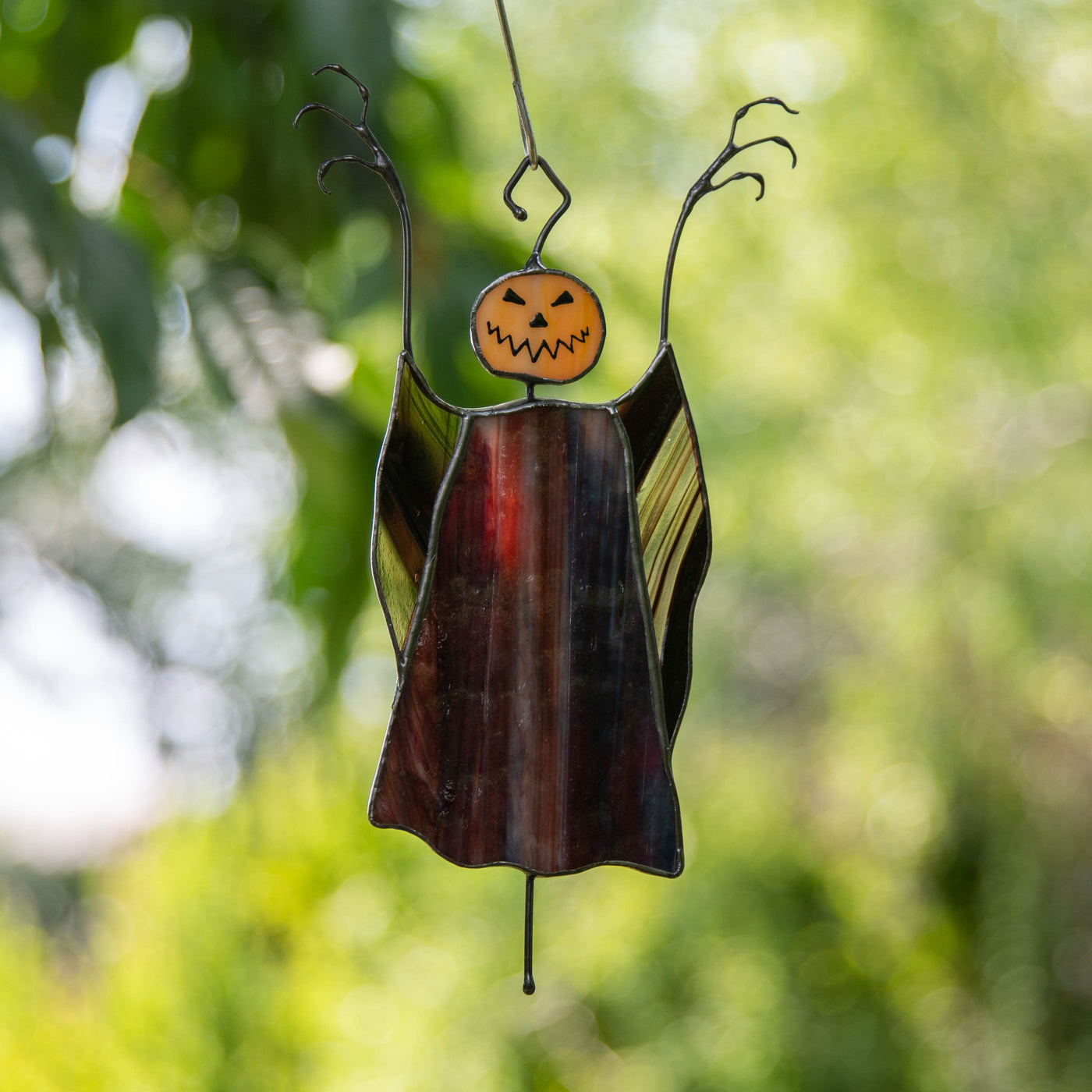 Stained glass pumpkin headed scarecrow window hanging for Halloween decor