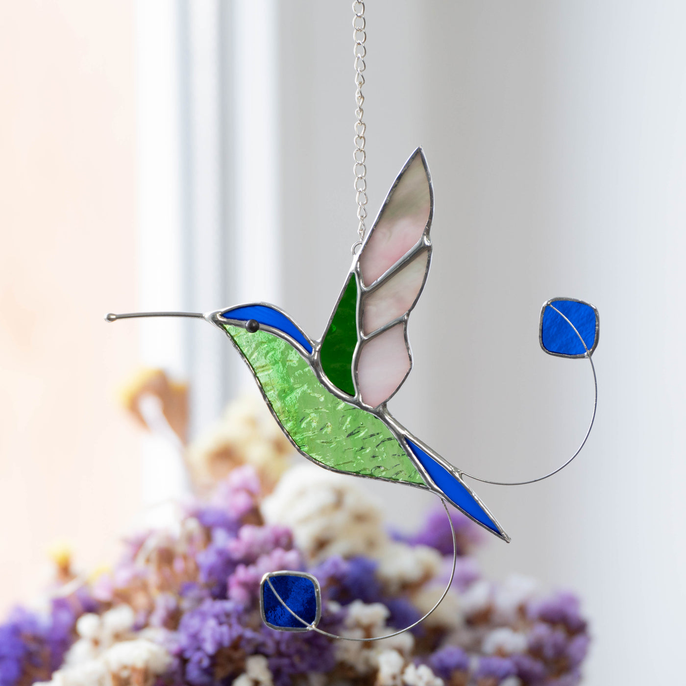 Zoomed stained glass racket-tail hummingbird window hanging