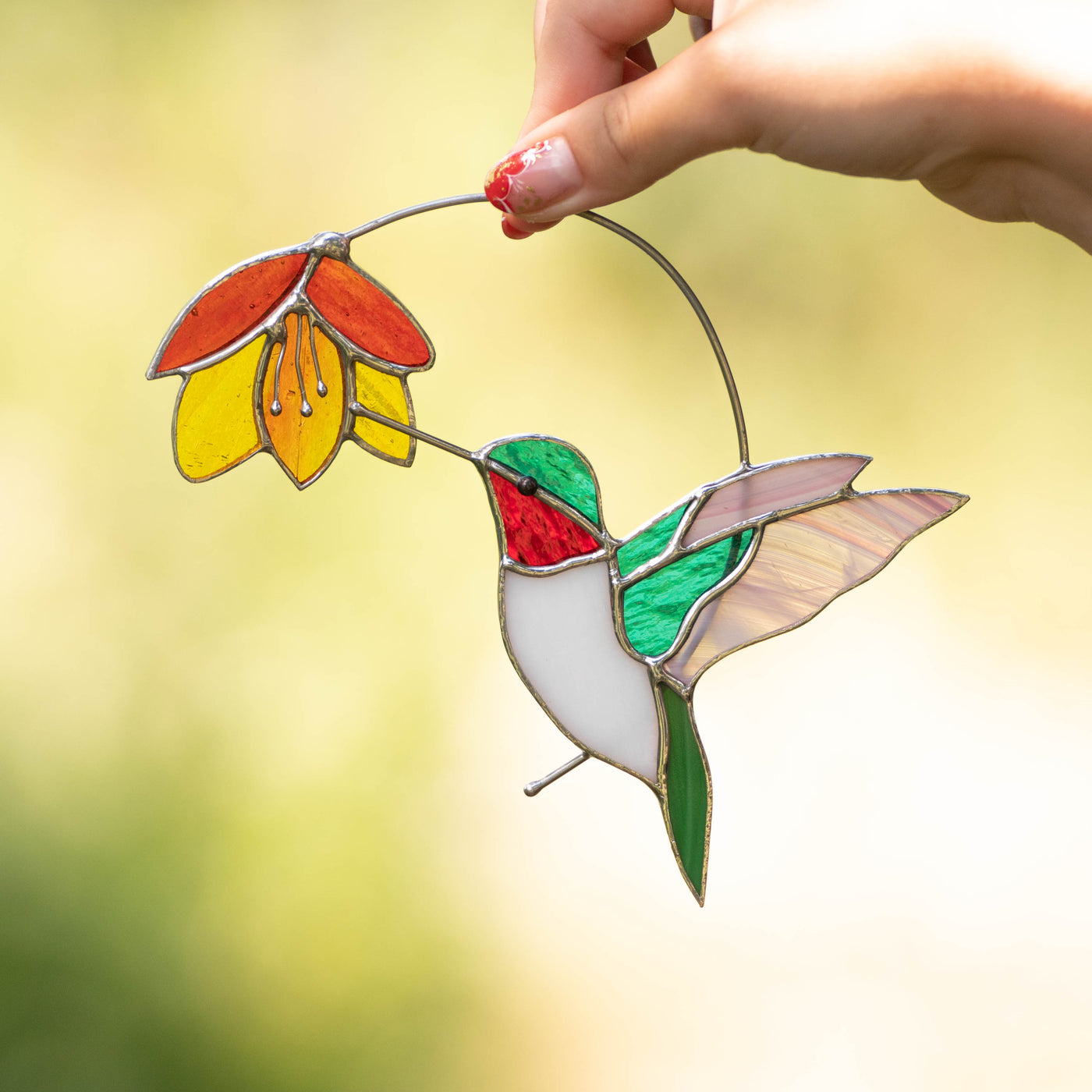 Stained glass hummingbird with red-orange flower suncatcher for home decor