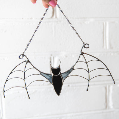 Black bat suncatcher of stained glass for Halloween celebrations