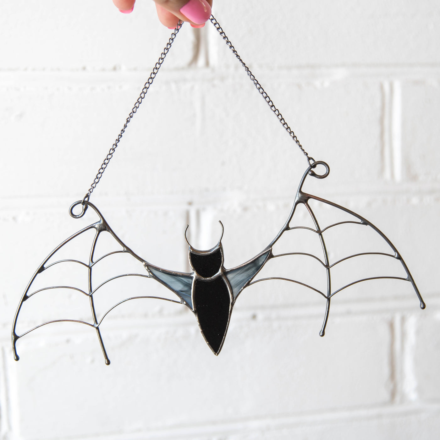 Black bat window hanging of stained glass for Halloween celebrations