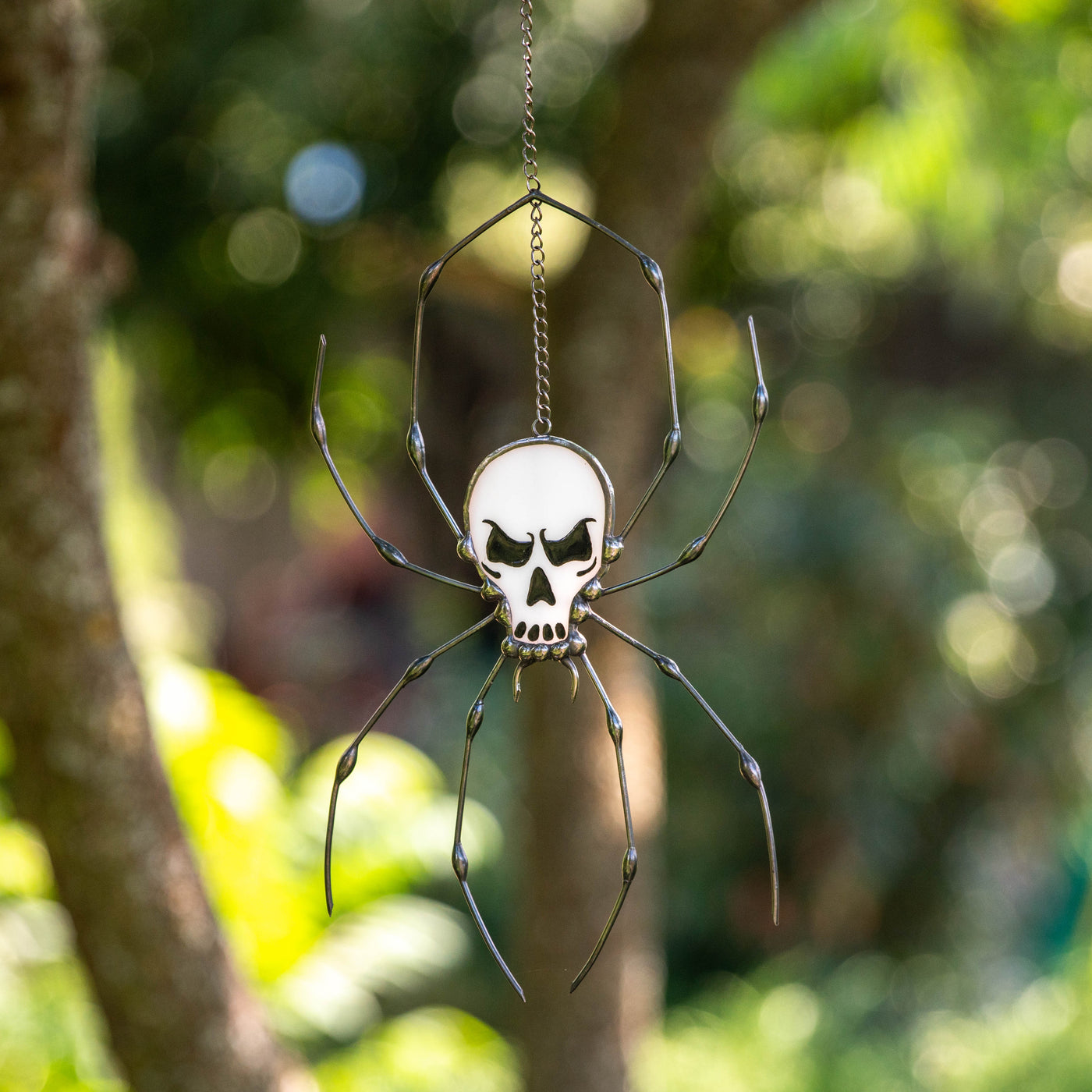 Creepy spider skeleton window hanging of stained glass