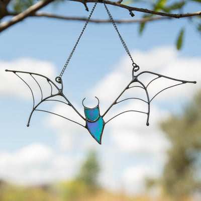 Stained glass Halloween suncatcher of iridescent bat