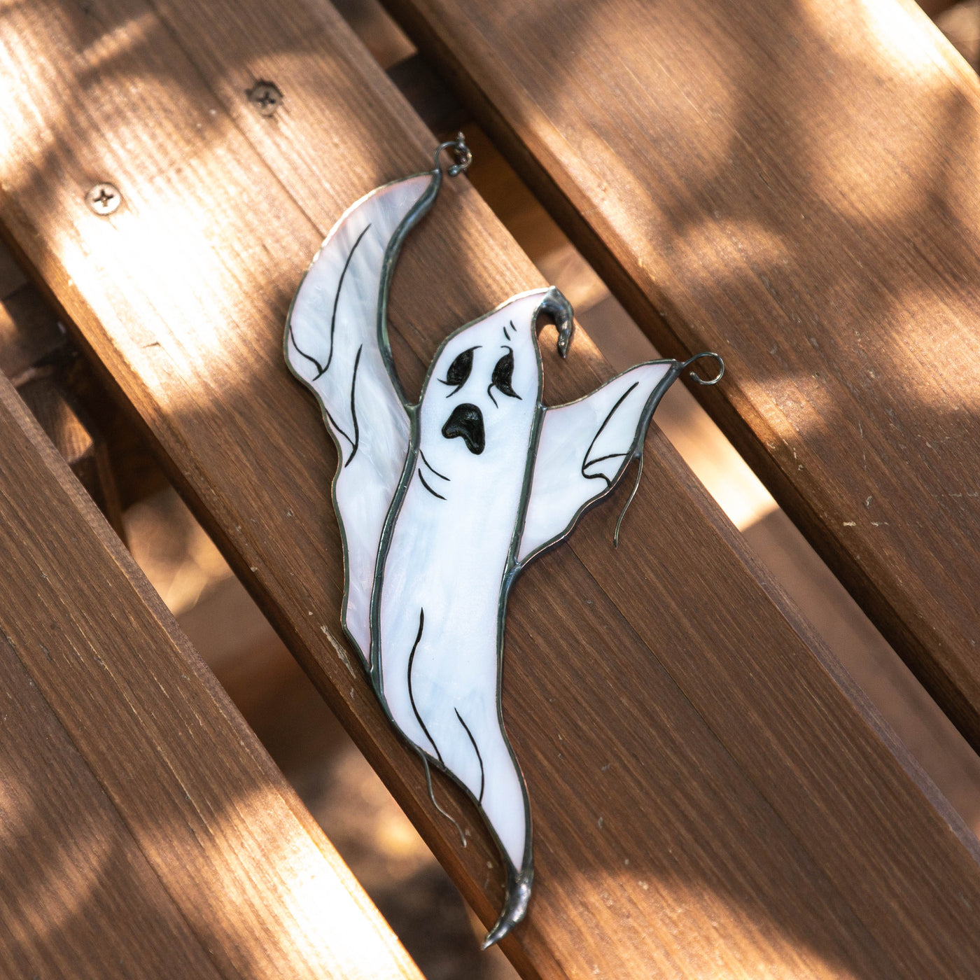 Stained glass suncatcher of flying ghost for Halloween 