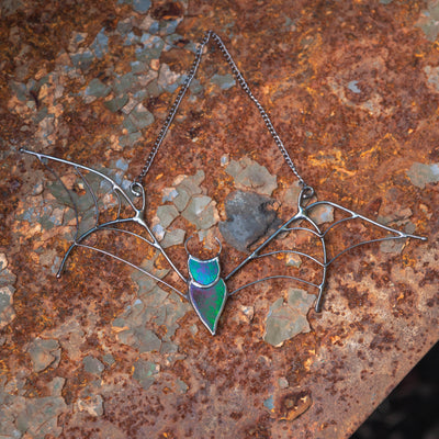Iridescent bat suncatcher of stained glass for Halloween party