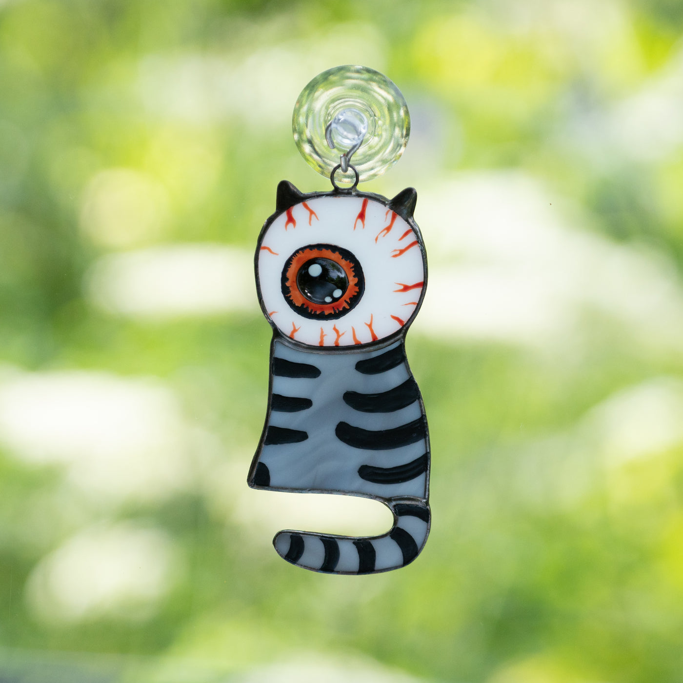 Stained glass grey cat with a huge eye instead of head suncatcher for Halloween decor