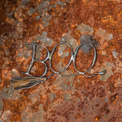 Creepy stained glass Lettering boo on witch's broom suncatcher