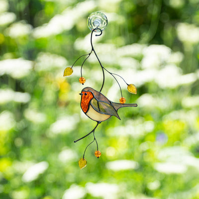 Suncatcher of a stained glass robin bird sitting on the branch
