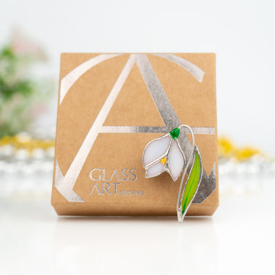 Snowdrop flower pin and a brand box