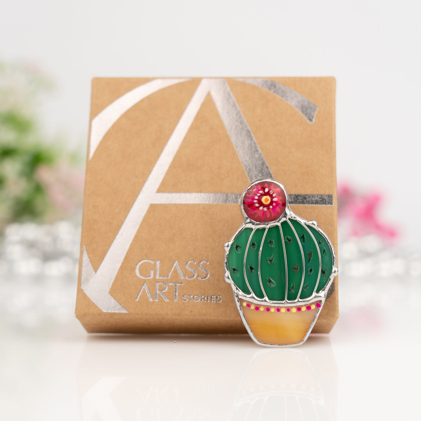 Stained glass cactus pin and a brand box